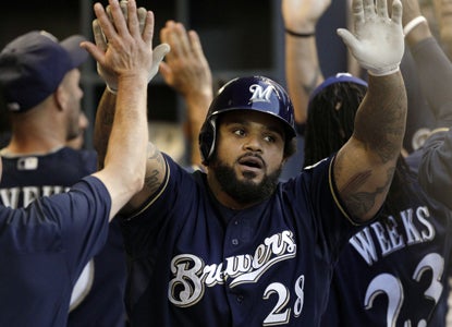 Prince Fielder (center) celebrates his two-run HR in the sixth inning, giving him an NL-best 67 RBI.  (Getty Images)