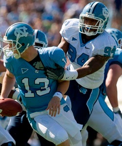 The 6-foot-7 McAdoo (94) plays in UNC's 2010 spring game, but sits out all of the subsequent season during the investigation. (AP)
