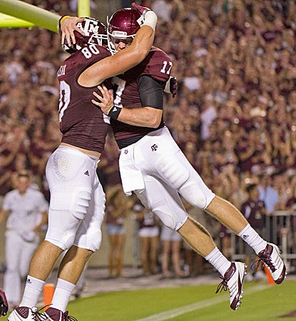Texas A&M's Hudson Prioleau (left) celebrates with QB Ryan Tannehill after a third-quarter touchdown. (AP)