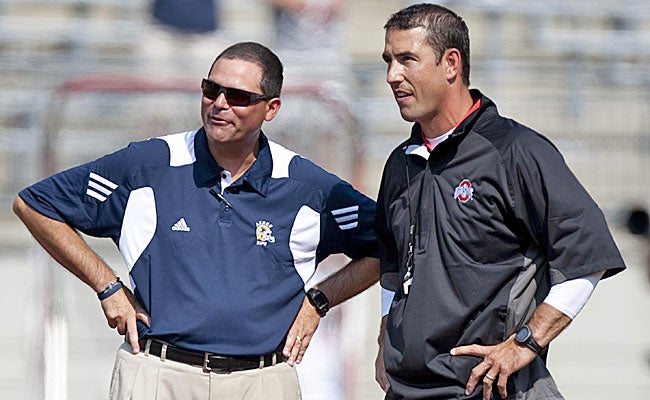 Akron's Rob Ianello and Ohio State's Luke Fickell chat. After the game, Ianello was unhappy. (US Presswire)