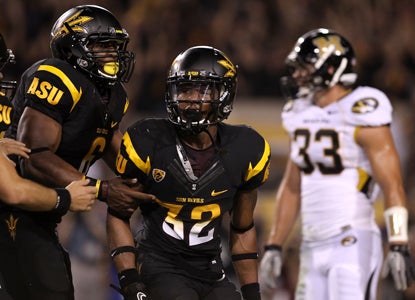 Jamal Miles (32) solidifies Arizona State's win over Missouri with an 11-yard TD reception in overtime.  (Getty Images)