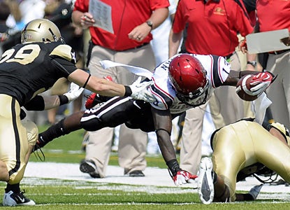 Ronnie Hillman, who finishes with 117 rushing yards and a pair of touchdowns, stretches out for extra yards against Army. (AP)