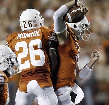 Backup QB Case McCoy (right) celebrates with RB D.J. Monroe as each play key roles in Texas' fourth-quarter comeback.  (AP)