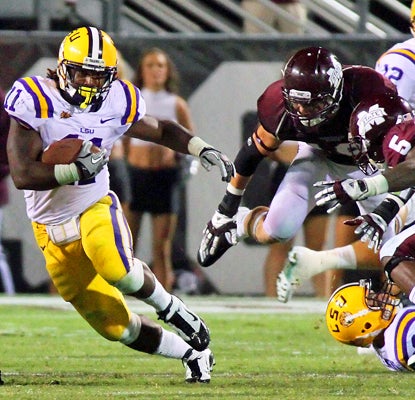 Spencer Ware runs through the line during the third quarter against the Bulldogs. (US Presswire)