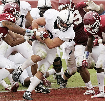 Michael Zordich rumbles in the end zone for the winning touchdown to stretch Penn State's win streak over Temple to 29.  (AP)