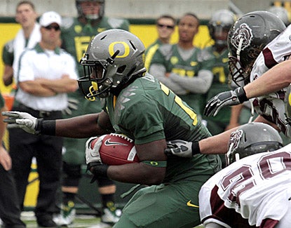 Oregon running back LaMichael James finds a hole through Missouri State defenders. James scored three times in the Ducks' win. (AP)