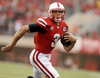 Taylor Martinez accounts for three touchdowns, including a 6-yard run, in Nebraska's 51-38 win over Washington. (AP)