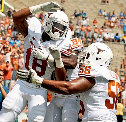 He scores in bunches: Texas tight end D.J. Grant abuses UCLA for the first three touchdown receptions of his career.  (AP)