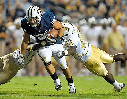 BYU running back Bryan Kariya scores on a 6-yard run in the fourth quarter to help the Cougars beat UCF 24-17. (US Presswire)