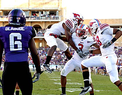 Darius Johnson (3) celebrates with teammates after catching a touchdown pass during SMU's 40-33 in overtime. (US Presswire)