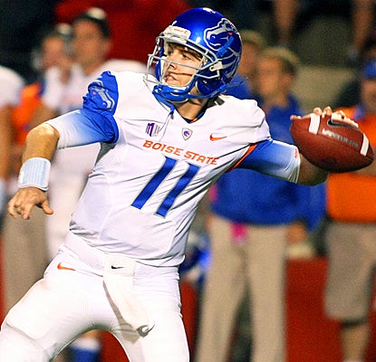 Boise State's Kellen Moore drops back for a pass during the first quarter against Fresno State. (AP)