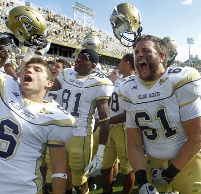 The Yellow Jackets celebrate their sixth victory of the season, matching their total from last season. (AP)