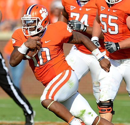 Clemson QB Tajh Boyd rushes for a touchdown and throws for another before leaving the game with a hip injury.  (AP)