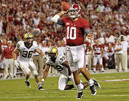 AJ McCarron passes for 237 yards and four touchdowns, including one here in the first half against Vanderbilt. (AP)