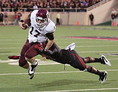 Ryan Tannehill runs for extra yards against Texas Tech. Tannehill runs for two touchdowns and throws for another. (US Presswire)