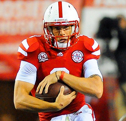 Nebraska's Taylor Martinez runs for 102 yards, throws for 191 yards and scores three touchdowns against Ohio State. (Getty Images)
