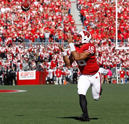Nobody's around to keep Wisconsin QB Russell Wilson from hauling in this 25-yard touchdown pass.  (Getty Images)