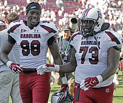 South Carolina's Devin Taylor (98) and Rokevious Watkins celebrate after beating Mississippi State.  (AP)
