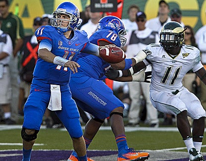 Boise State quarterback Kellen Moore throws for 338 yards and four touchdowns in the 63-13 win. (US Presswire)