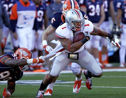 Ohio State running back Dan Herron breaks away from Illinois defensive back Michael Buchanan during the Buckeyes' win. (AP)