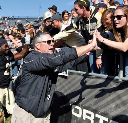 Coach Danny Hope and Purdue fans celebrate the team's first win over a ranked opponent since beating Ohio State in 2009. (AP)