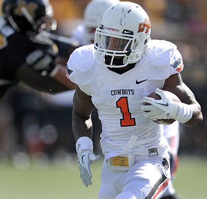 Joseph Randle accounts for four Oklahoma State touchdowns -- three rushing (16, 59, 12 yards), one receiving (13 yards).  (AP)