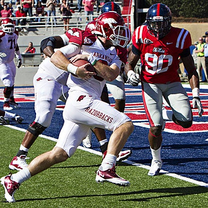 Arkansas' Tyler Wilson steps into the end zone. The Hogs' QB scores two rushing TDs.  (Getty Images)