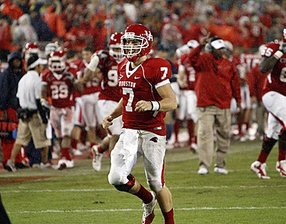 Houston's Case Keenum celebrates after throwing his record ninth touchdown pass in the Cougars' 73-34 win over Rice. (US Presswire)