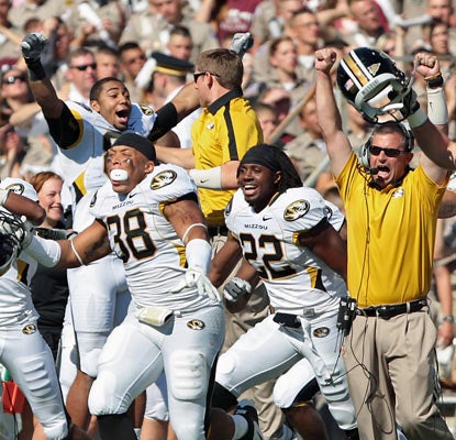 Missouri's sideline erupts after clinching an overtime win against the No. 16 Aggies in College Station.  (US Presswire)
