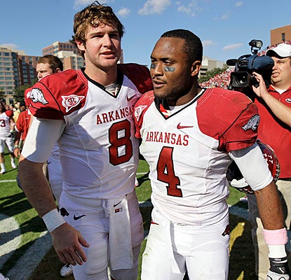 Tyler Wilson and Jarius Wright celebrate after helping dig Arkansas out of a two-touchdown hole at Vanderbilt.  (AP)