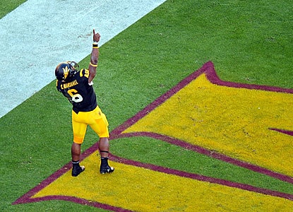 Cameron Marshall enjoys being in the end zone.  He celebrates one of his three rushing touchdowns on the day. (US Presswire)