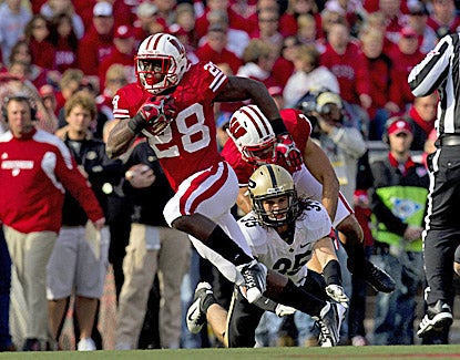 Wisconsin's Montee Ball rushes for a career-high 223 yards and three touchdowns in the Badgers' 62-17 rout of Purdue. (US Presswire)