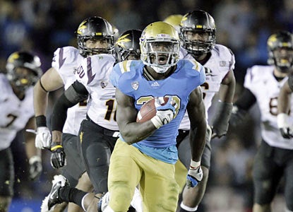 UCLA's Derrick Coleman rumbles for 119 yards and two TDs, including the winning score with less than a minute in regulation. (AP)