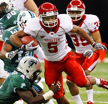 Houston's Charles Sims bowls over Tulane for a career-high 207 yards and two touchdowns.  (AP)