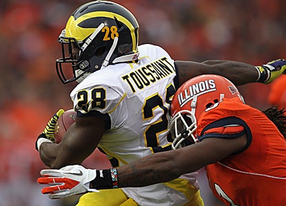 Fitzgerald Toussaint completes a 65-yard run against the Illini D.  He finishes with 192 yards on the ground. (Getty Images)