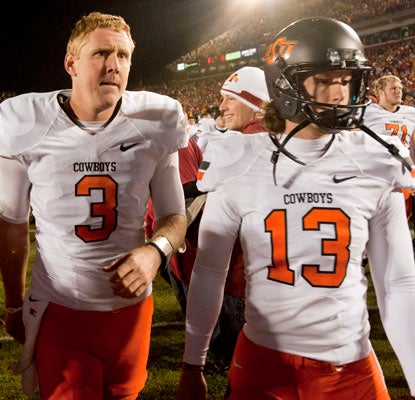 Quarterback Brandon Weeden (3) throws three interceptions and kicker Quinn Sharp misses a key kick in OSU's loss.  (US Presswire)
