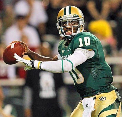 Baylor's Robert Griffin III completes 21 of 34 passes for 479 yards and four touchdowns. (Getty Images)