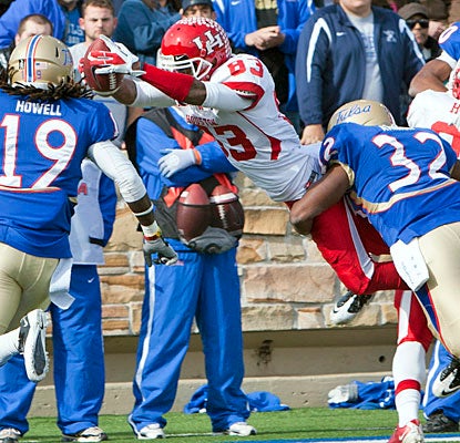 Houston's Patrick Edwards (eight receptions, 181 yards) dives for one of his four touchdowns.  (US Presswire)