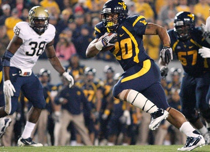 Shawne Alston keeps WVU's conference title and BCS dreams alive by taking it to the house twice in the second half. (Getty Images)