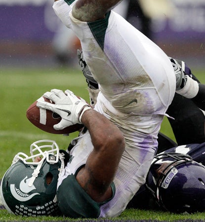 B.J. Cunningham catches a 29-yard TD pass in the second half.  The MSU wideout finishes with six receptions for 120 yards. (AP)