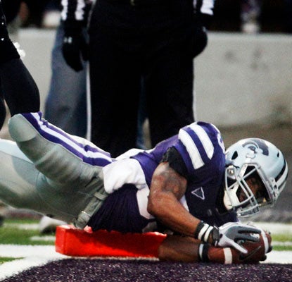 John Hubert dives for the go-ahead touchdown and tallies 120 yards rushing against Iowa State.  (AP)