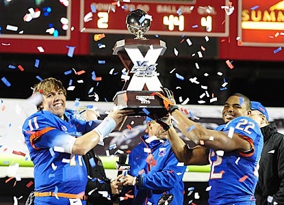 Kellen Moore (left) and game MVP Doug Martin (two touchdowns; 151 rushing yards) hoist the Las Vegas Bowl trophy.  (US Presswire)