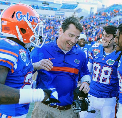 First-year Florida coach Will Muschamp can enjoy the victory as the Gators avoid their first losing season since 1979.  (Getty Images)