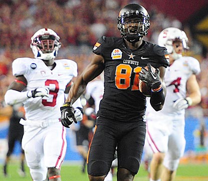 Despite a thigh ailment, Justin Blackmon notches touchdowns of 43 and 67 yards on his first two catches.  (US Presswire)