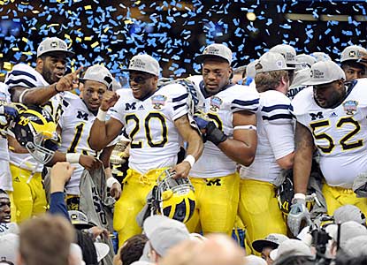 Michigan (11-2) celebrates its first victory in a BCS bowl game since the 2000 Orange Bowl.  (US Presswire)