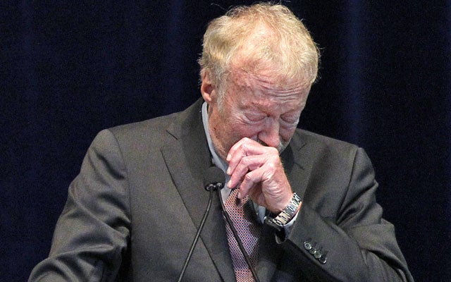 Phil Knight tries to contain his emotions while addressing the crowd at the Paterno memorial. (AP)
