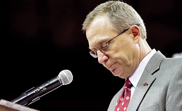 Long finds it hard to speak at times during his press conference to announce Petrino's termination. (AP)