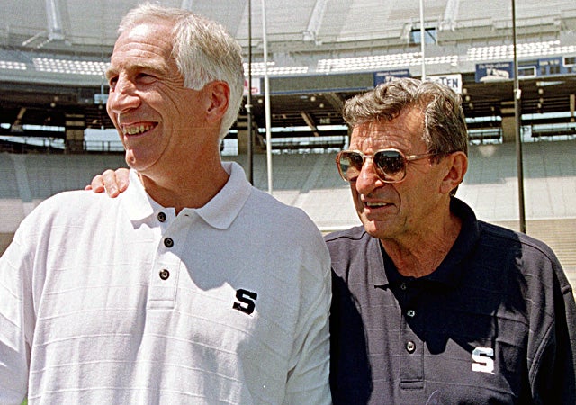 Jerry Sandusky and the late Joe Paterno share a laugh together in 1999. (AP)