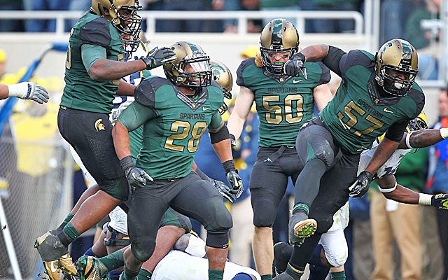 Narduzzi's fired-up defense stuffed Michigan to make it four in a row over the hated Wolverines. 