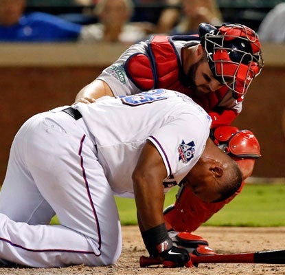 Adrian Beltre is hit in the helmet by Red Sox reliever Vicente Padilla and has to leave the game in the eighth inning.  (US Presswire)